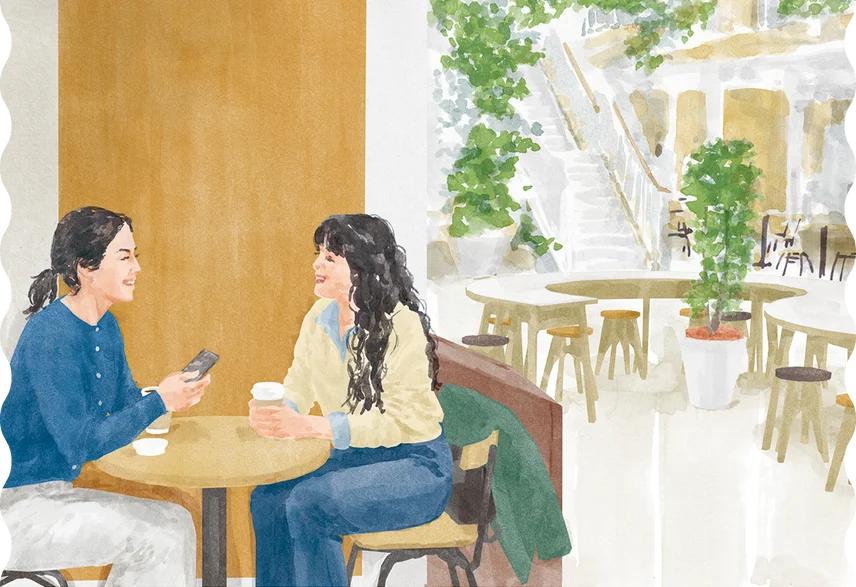 カフェで談笑するふたりの女性の水彩イラスト